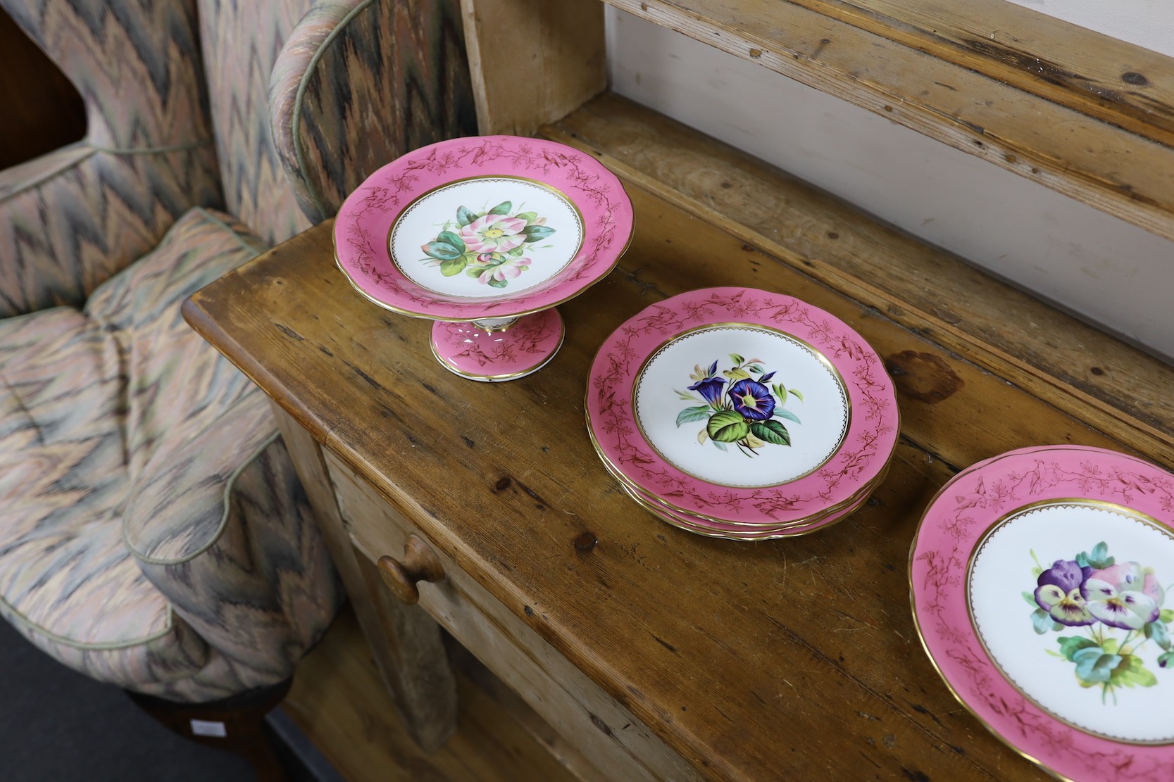 An English porcelain pink ground floral dessert service, late 19th century